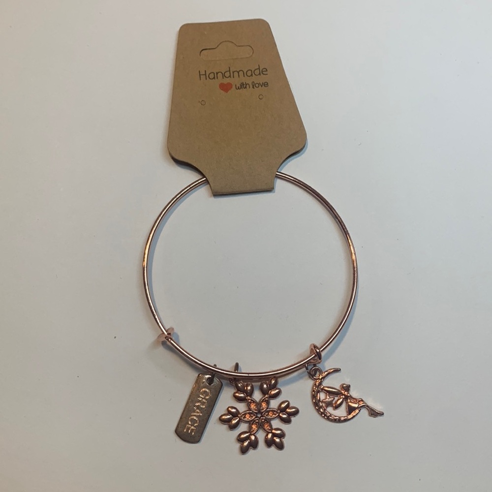 Handmade rose gold stainless steel bracelet with 3 charms.